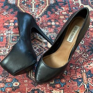 Black leather platform pumps